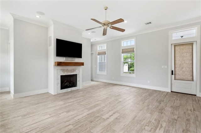 640 Bocage Ct N, Covington, LA 70433 - unfurnished living room featuring light wood finished floors, ornamental molding, a ceiling fan, a fireplace, and baseboards
