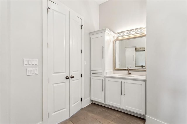 bathroom with tile patterned flooring and vanity