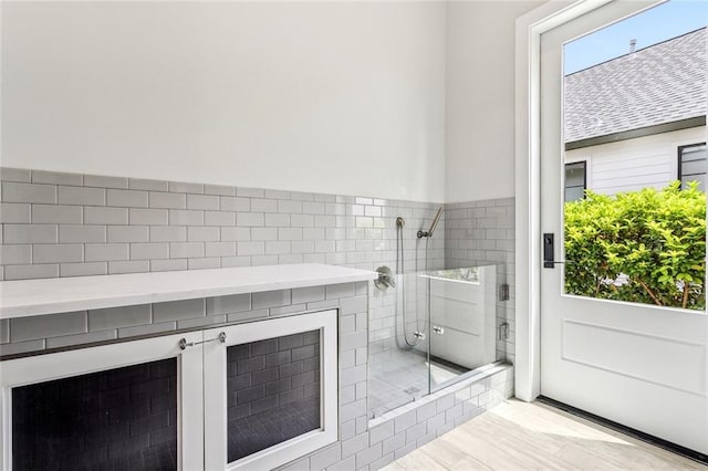 bathroom with a shower stall