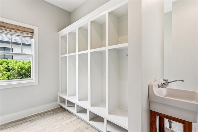 640 Bocage Ct N, Covington, LA 70433 - mudroom with wood finished floors, a sink, and baseboards