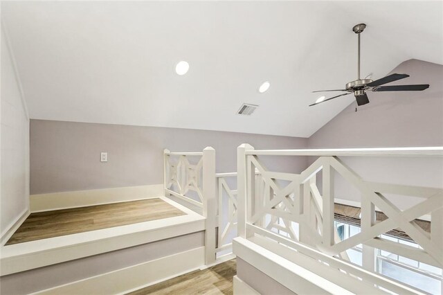 640 Bocage Ct N, Covington, LA 70433 - stairs with vaulted ceiling, wood finished floors, recessed lighting, ceiling fan, and baseboards