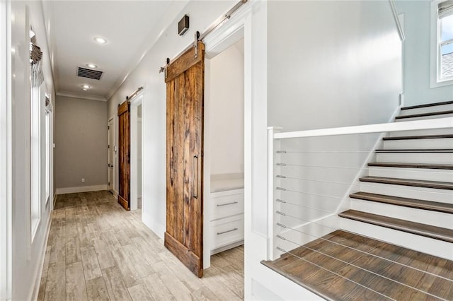 640 Bocage Ct N, Covington, LA 70433 - stairs featuring a barn door, wood finished floors, baseboards, ornamental molding, and recessed lighting