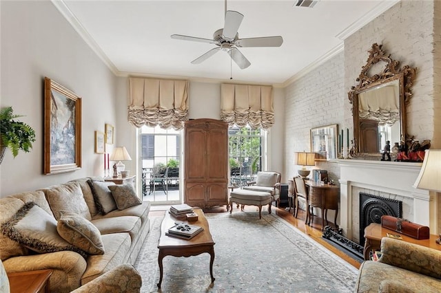 931 Chartres Street 13&14, New Orleans, LA 70116 - living room with visible vents, ornamental molding, a fireplace, wood finished floors, and a ceiling fan