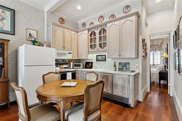 931 Chartres Street 13&14, New Orleans, LA 70116 - kitchen featuring dark wood finished floors, ornamental molding, a sink, and white appliances