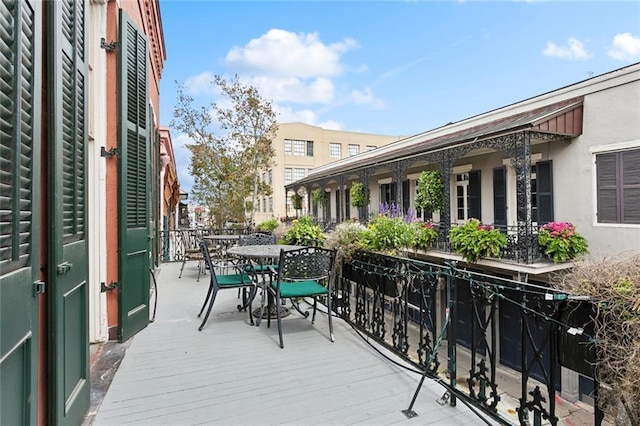 931 Chartres Street 13&14, New Orleans, LA 70116 - wooden terrace featuring outdoor dining space