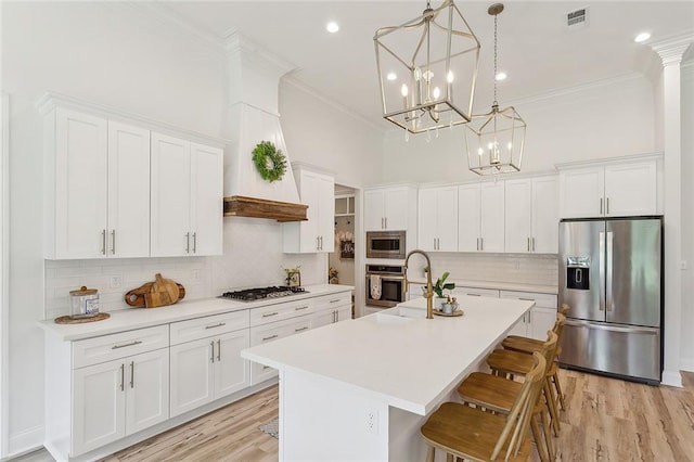 16202 W Bennett Rd, Loranger, LA 70446 - kitchen with stainless steel appliances, crown molding, a sink, a kitchen breakfast bar, and decorative backsplash