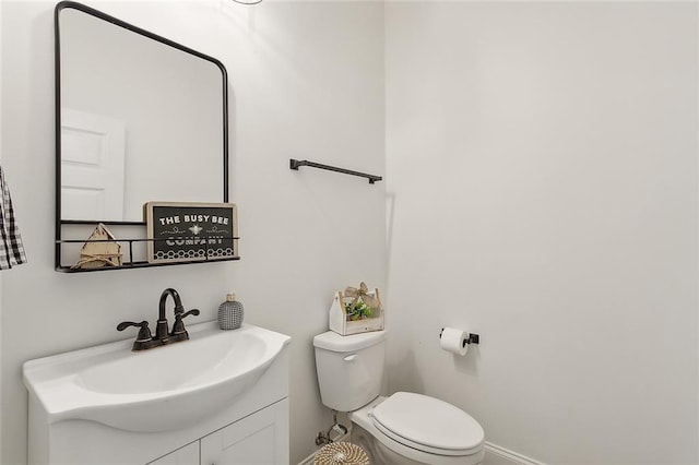 16202 W Bennett Rd, Loranger, LA 70446 - bathroom with toilet, baseboards, and vanity