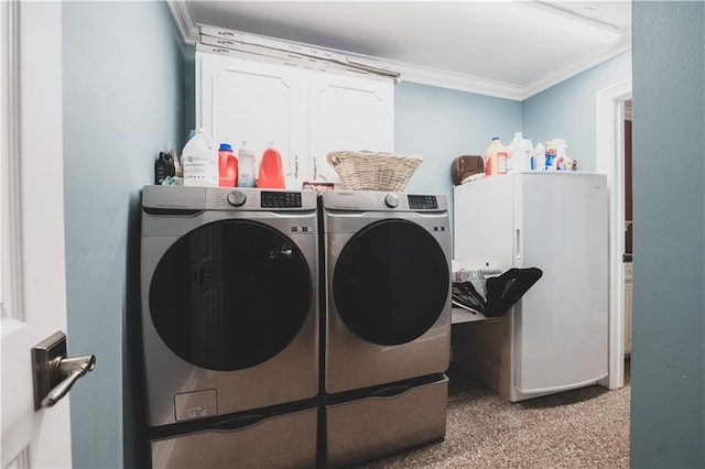 5613 W Esplanade Ave, Metairie, LA 70003 - laundry room with washing machine and dryer, cabinet space, carpet flooring, and crown molding