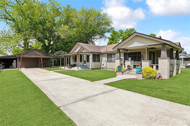 ranch-style house featuring a garage, driveway, a front yard, and covered porch