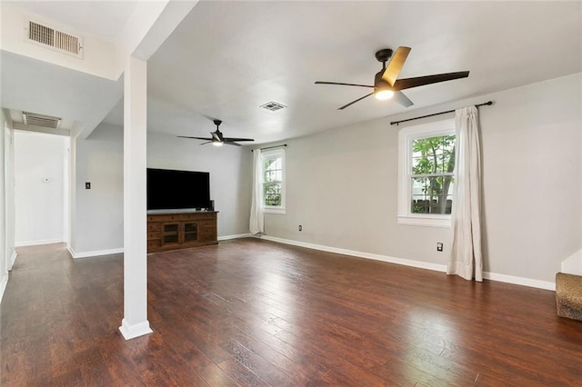 unfurnished living room with ceiling fan, wood finished floors, and visible vents