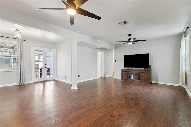 unfurnished living room with wood finished floors, visible vents, ceiling fan, and french doors