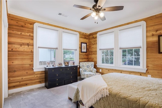 5839 Vicksburg St, New Orleans, LA 70124 - carpeted bedroom featuring baseboards, wooden walls, visible vents, and ceiling fan