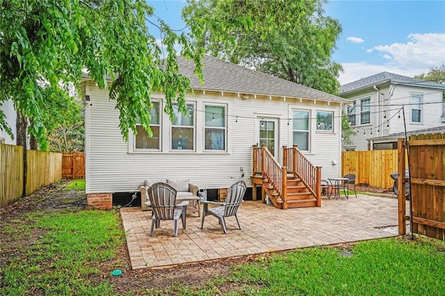 5839 Vicksburg St, New Orleans, LA 70124 - back of property featuring a fenced backyard, roof with shingles, and a patio