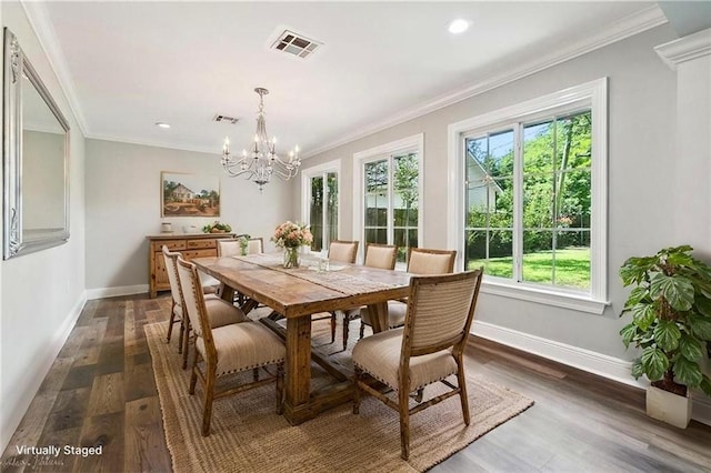 dining space featuring baseboards, visible vents, and a wealth of natural light