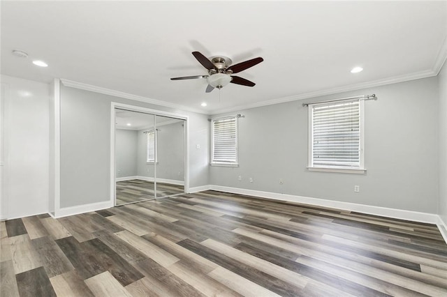 unfurnished bedroom with recessed lighting, a closet, and crown molding