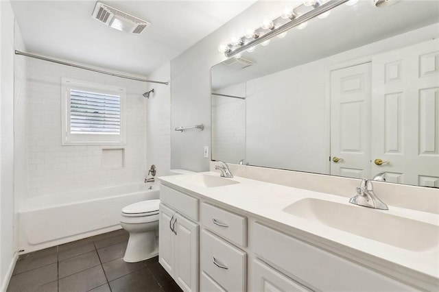 full bathroom featuring tile patterned floors, visible vents, a sink, and toilet