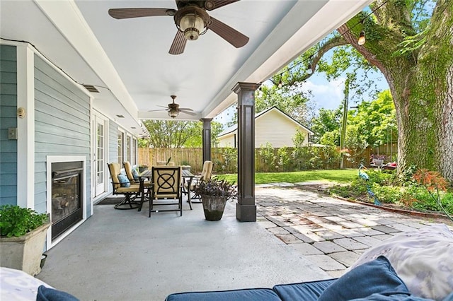 view of patio / terrace featuring a fenced backyard, visible vents, outdoor dining space, and ceiling fan