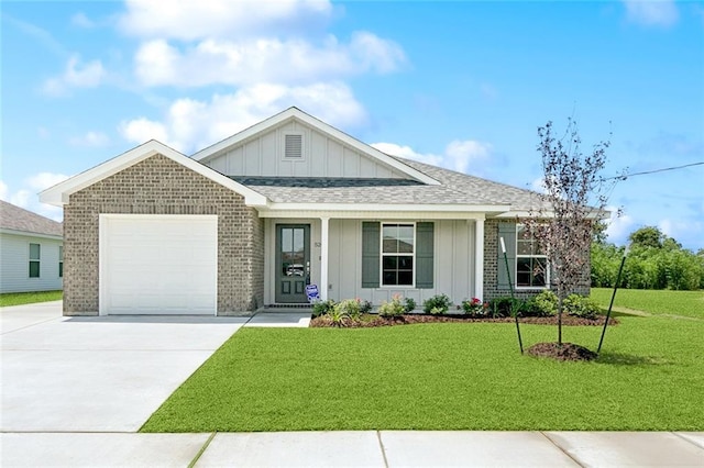 524 Helis Dr, Waggaman, LA 70094 - view of front of property featuring board and batten siding, driveway, brick siding, a garage, and a front lawn