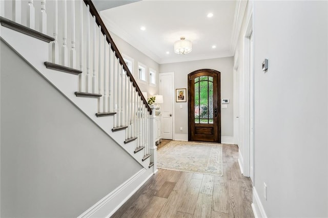 900 French St, New Orleans, LA 70124 - foyer featuring recessed lighting, wood finished floors, crown molding, baseboards, and stairs
