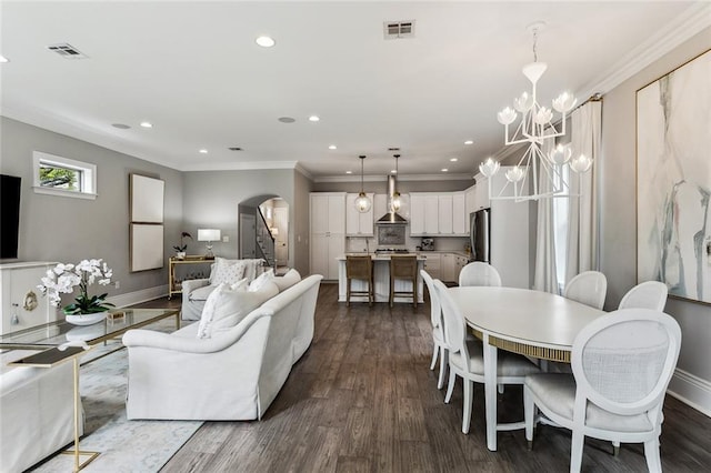 900 French St, New Orleans, LA 70124 - dining room featuring arched walkways, crown molding, stairs, and visible vents