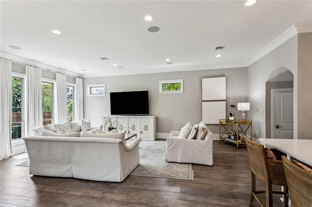 900 French St, New Orleans, LA 70124 - living room with plenty of natural light, visible vents, arched walkways, and ornamental molding