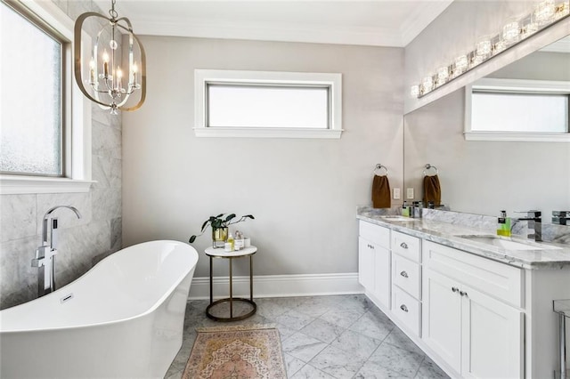 900 French St, New Orleans, LA 70124 - full bathroom featuring a sink, marble finish floor, double vanity, a freestanding bath, and a notable chandelier