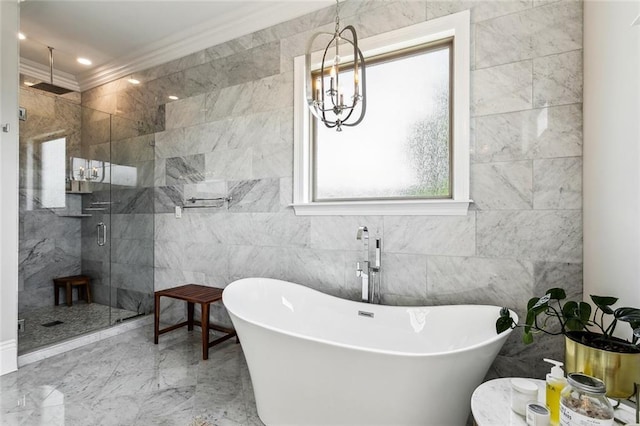 900 French St, New Orleans, LA 70124 - bathroom featuring a shower stall, a freestanding bath, tile walls, crown molding, and a notable chandelier