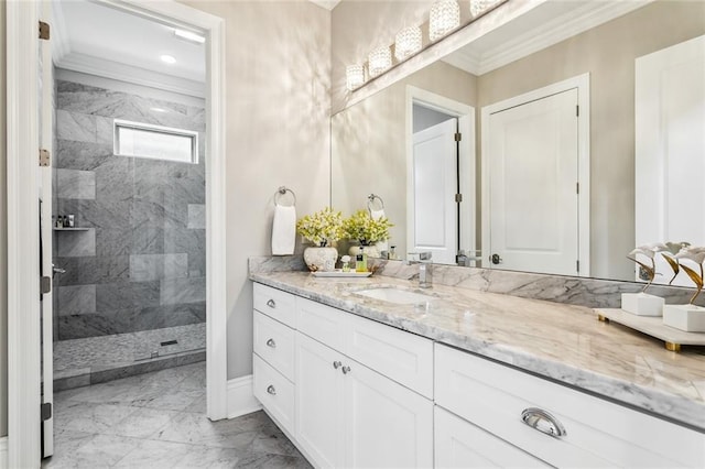 900 French St, New Orleans, LA 70124 - bathroom featuring marble finish floor, vanity, crown molding, baseboards, and tiled shower
