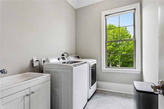 900 French St, New Orleans, LA 70124 - clothes washing area with cabinet space, independent washer and dryer, a healthy amount of sunlight, and crown molding