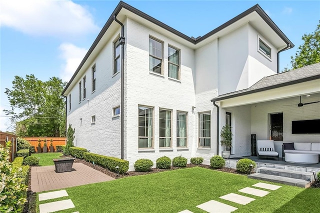 900 French St, New Orleans, LA 70124 - rear view of property featuring an outdoor hangout area, a patio area, a lawn, and fence