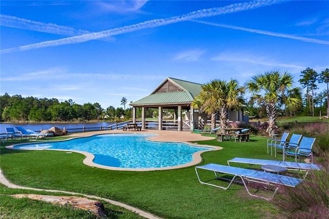 pool featuring a lawn, a gazebo, and a patio