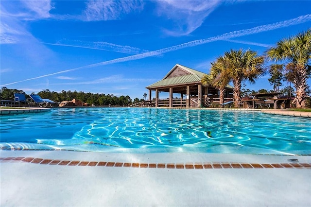 community pool with a gazebo