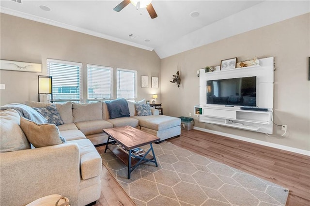 living area with wood finished floors, ceiling fan, baseboards, ornamental molding, and visible vents