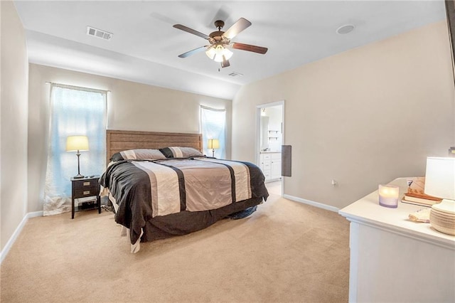 bedroom featuring light colored carpet, baseboards, and visible vents