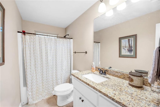 full bathroom featuring toilet, vanity, and tile patterned floors