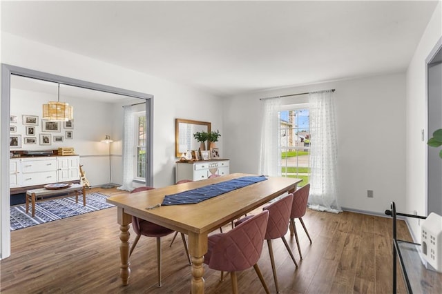 4716 Elmwood Pkwy, Metairie, LA 70003 - dining room featuring plenty of natural light, baseboards, and wood finished floors