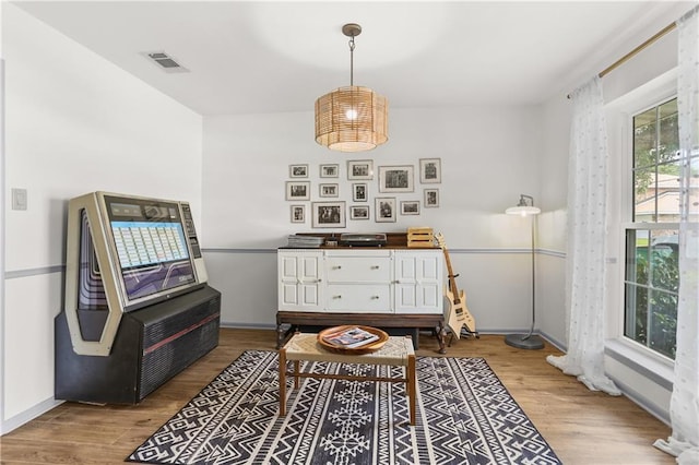 4716 Elmwood Pkwy, Metairie, LA 70003 - living area with visible vents, baseboards, and wood finished floors