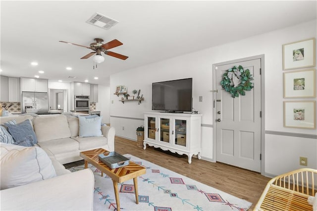 4716 Elmwood Pkwy, Metairie, LA 70003 - living area featuring recessed lighting, wood finished floors, visible vents, a ceiling fan, and baseboards