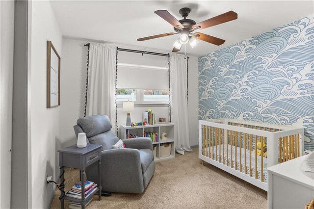 4716 Elmwood Pkwy, Metairie, LA 70003 - carpeted bedroom featuring a crib and ceiling fan