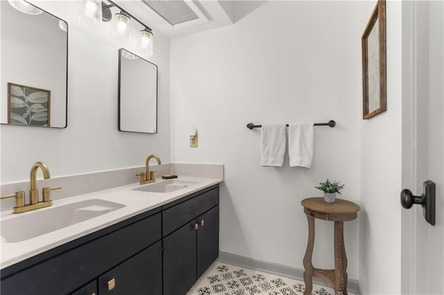 4716 Elmwood Pkwy, Metairie, LA 70003 - bathroom featuring visible vents, tile patterned flooring, baseboards, and a sink