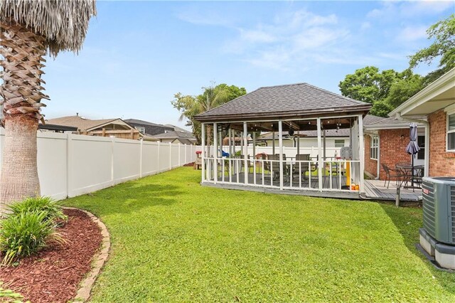 4716 Elmwood Pkwy, Metairie, LA 70003 - view of yard with a fenced backyard, a gazebo, central air condition unit, and a deck