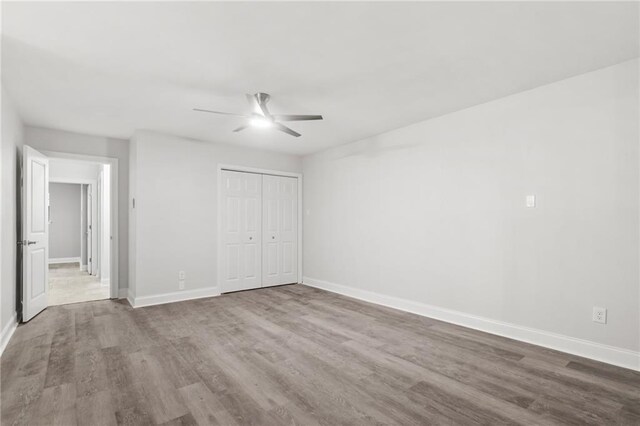 1534 Holiday Pl, New Orleans, LA 70131 - unfurnished bedroom with baseboards, a ceiling fan, wood finished floors, and a closet