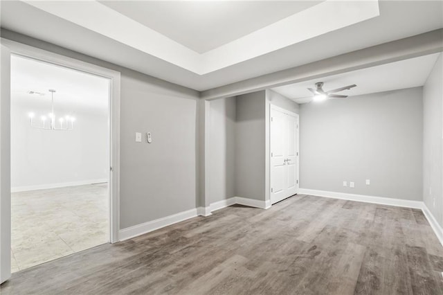 1534 Holiday Pl, New Orleans, LA 70131 - empty room featuring ceiling fan with notable chandelier, wood finished floors, and baseboards