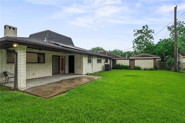 1534 Holiday Pl, New Orleans, LA 70131 - rear view of house with a yard, roof with shingles, fence, and a patio area