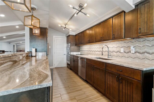 7930 Breakwater Drive 52&53, New Orleans, LA 70124 - kitchen featuring light stone countertops, stainless steel appliances, a sink, and backsplash