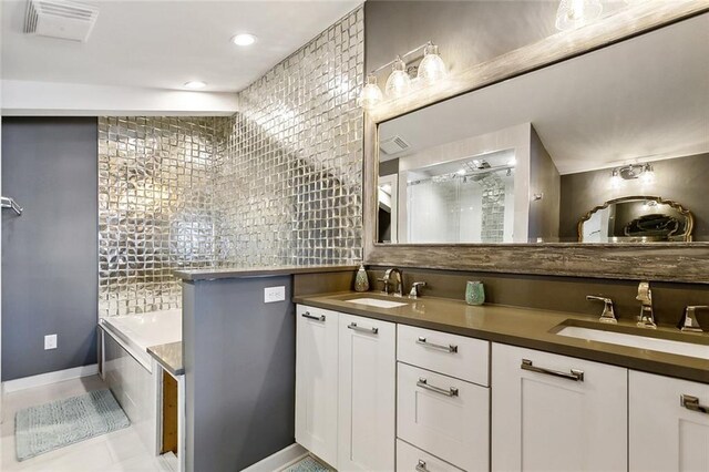 7930 Breakwater Drive 52&53, New Orleans, LA 70124 - bathroom with tile patterned flooring, visible vents, a sink, and a bathing tub