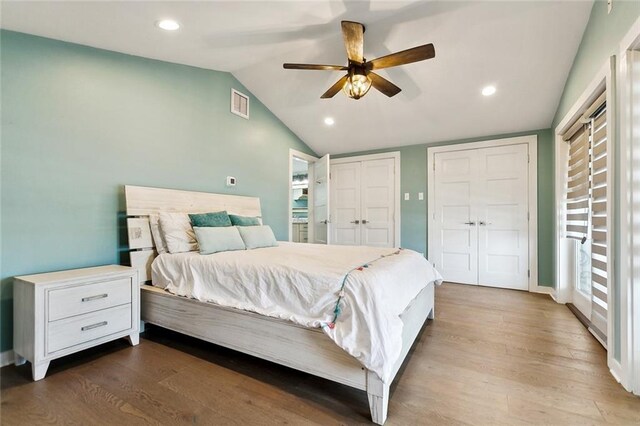 7930 Breakwater Drive 52&53, New Orleans, LA 70124 - bedroom with vaulted ceiling, visible vents, recessed lighting, wood finished floors, and multiple closets