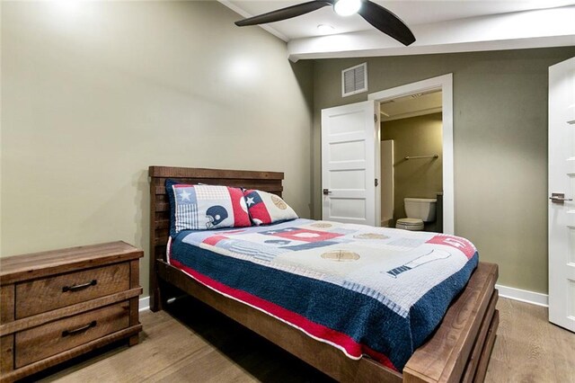 7930 Breakwater Drive 52&53, New Orleans, LA 70124 - bedroom featuring baseboards, visible vents, wood finished floors, ceiling fan, and ensuite bath