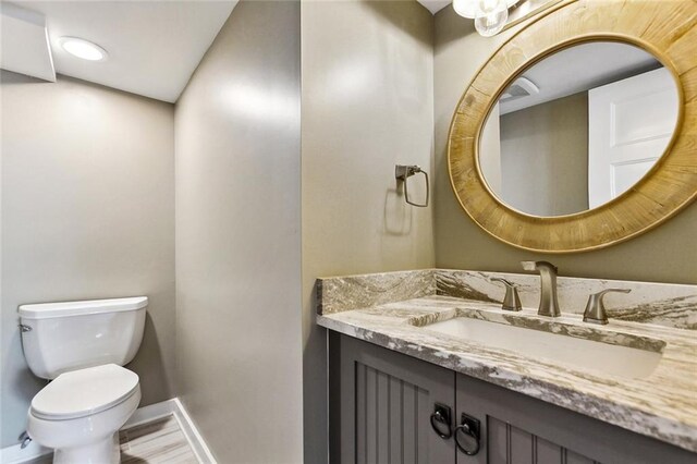7930 Breakwater Drive 52&53, New Orleans, LA 70124 - bathroom with baseboards, toilet, and vanity