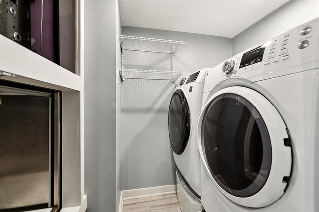7930 Breakwater Drive 52&53, New Orleans, LA 70124 - laundry room with separate washer and dryer, baseboards, and laundry area
